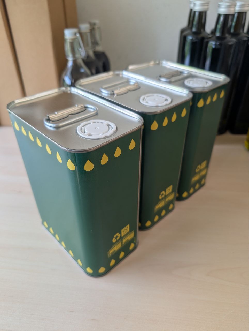 Three 2-liter steel containers of premium olive oil from Southern Italy, perfect for bulk orders